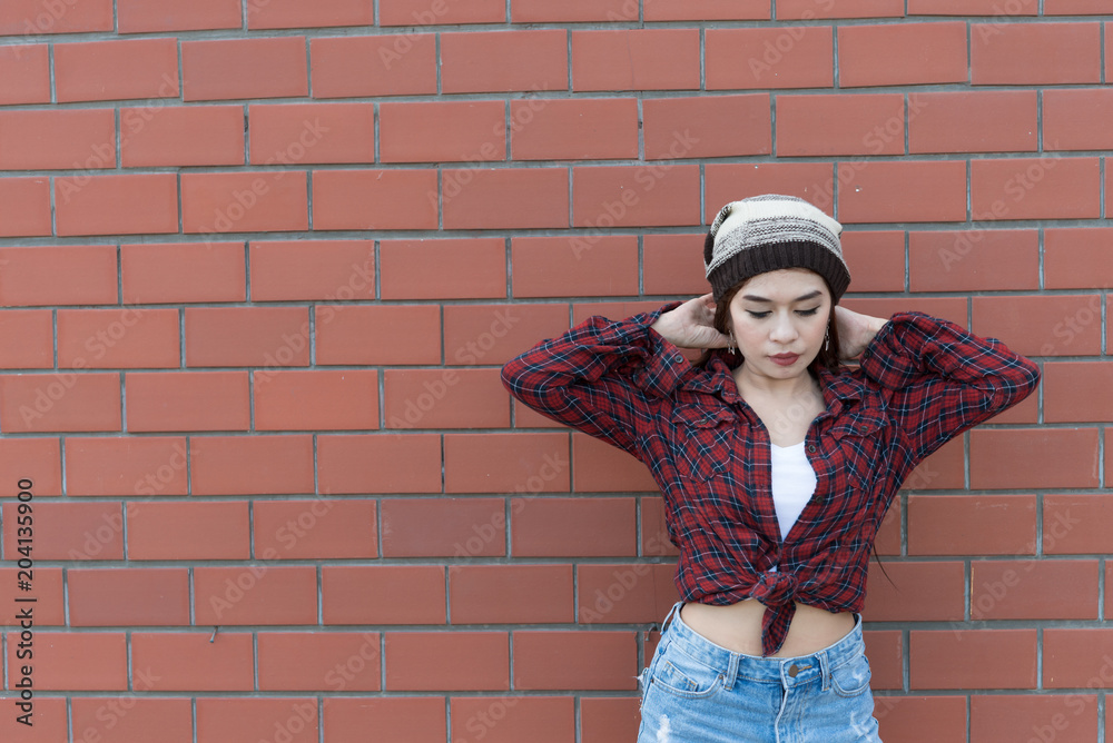 Portrait asian hipster girl on brick wall background,Hippie dress style,Thailand modern woman lifestyle,Beauty fashion portrait outdoor Portrait asian hipster girl on brick wall background,Hippie dress style,Thailand modern woman lifestyle,Beauty fashion portrait outdoor