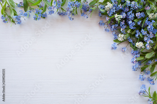 Forget-me-nots on a wooden background