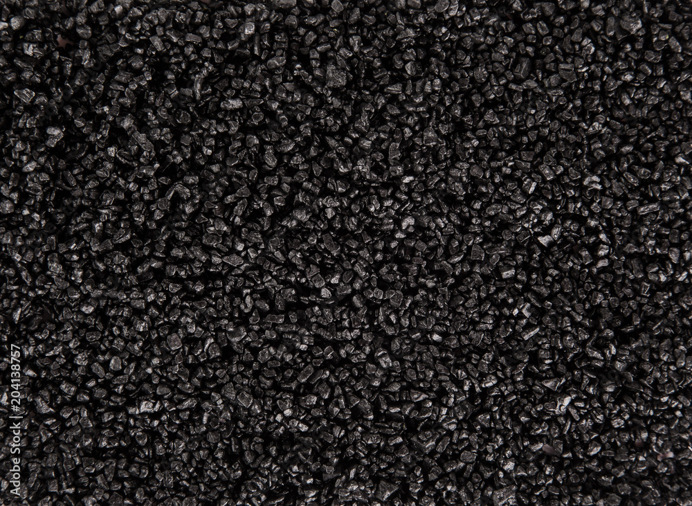 Black coarse grain salt heap texture.
