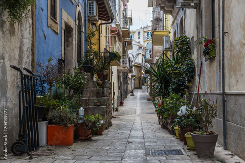 Street of the old town with houses of the historic village of Ragusa in Sicily, Italy © Corrado