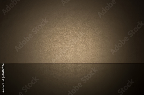 The background is gray with its own reflection in the lower third of the image.