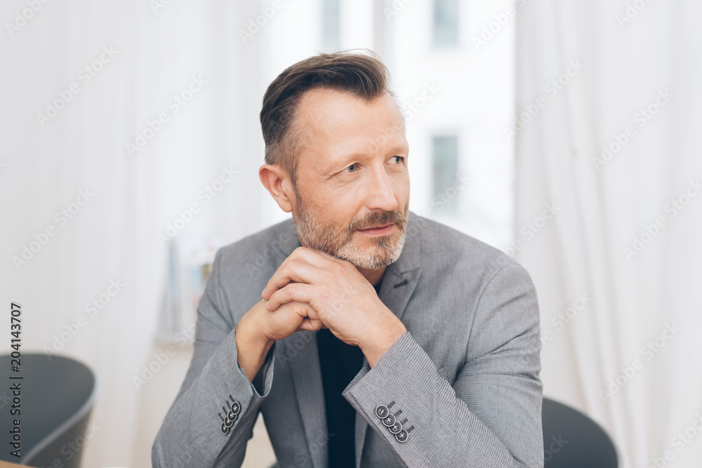 Portrait of mature man wearing grey jacket Portrait of mature man wearing grey jacket