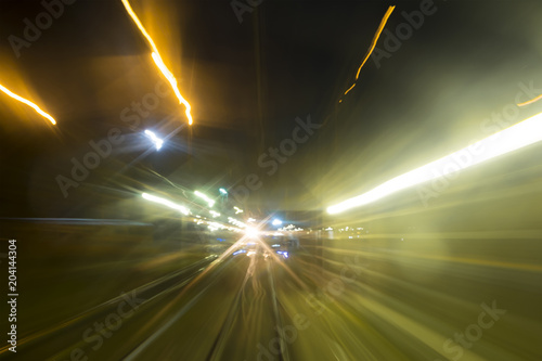 View from the cabin of the train at night. Futuristic abstract in. Fuzzy transport background.