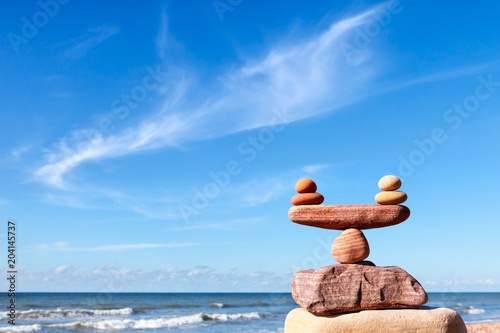 concept of life balance and harmony. Balance stones against the sea.