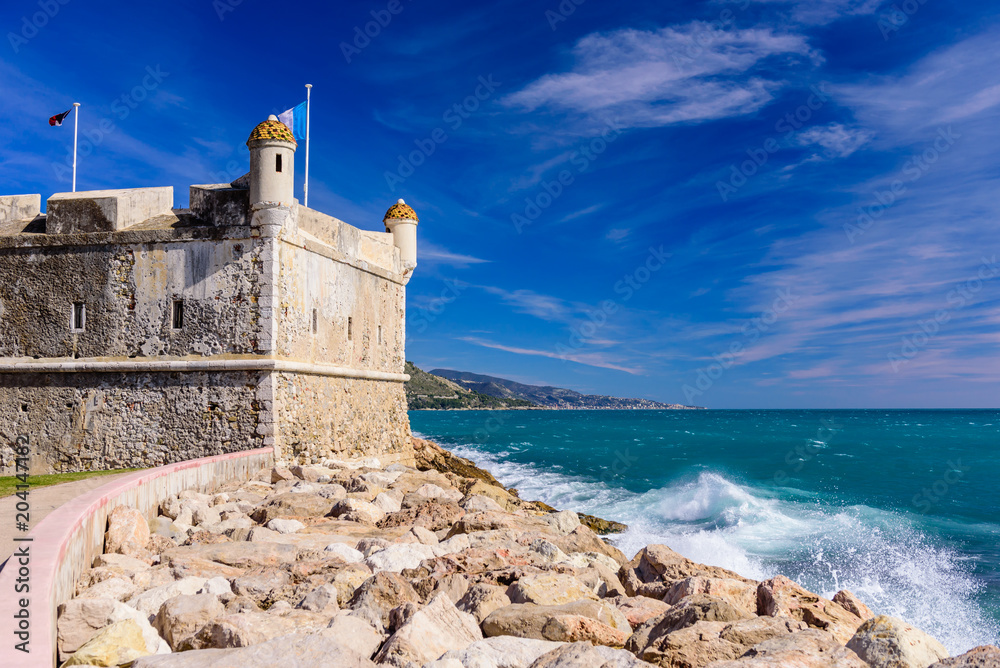 View on the castle in Menton during a Sunny day on a background of blue sea, Menton city, Cote d'azur, France