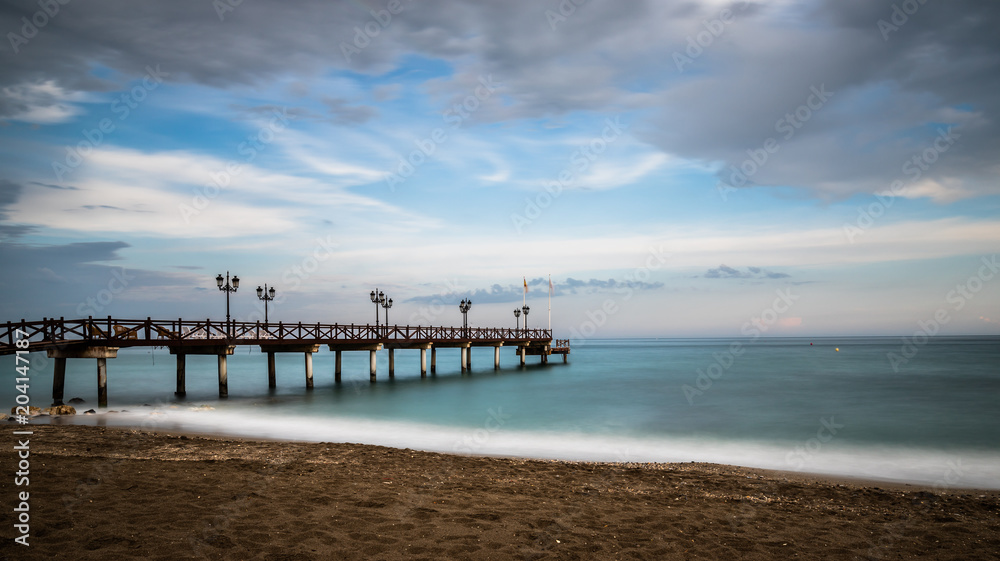 Beach in Marbella at Sunset on a cloudy day