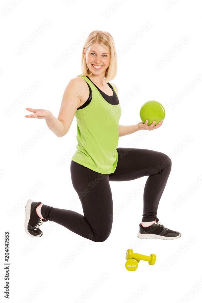 Beautiful young woman in bright sportswear with ball and dumbbells, isolated on white background Beautiful young woman in bright sportswear with ball and dumbbells, isolated on white background