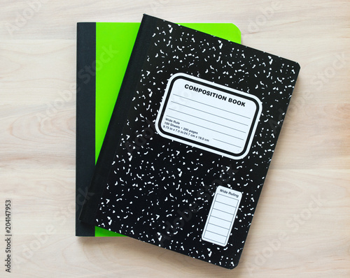 back to school-2 notebooks with an empty cover for customized title, on a wooden desk