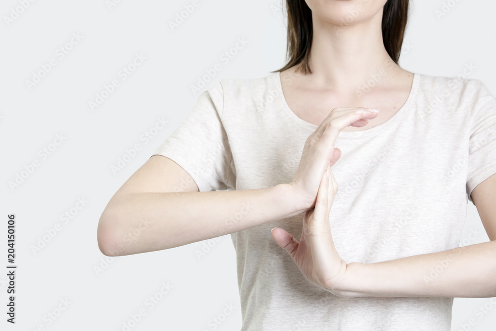 Wrist injury, woman stretching her wrist, Carpal tunnel syndrome Wrist injury, woman stretching her wrist, Carpal tunnel syndrome