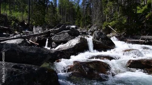 Waterfalls at stream Studeny Potok in High Tatras mountains, Slovakia photo