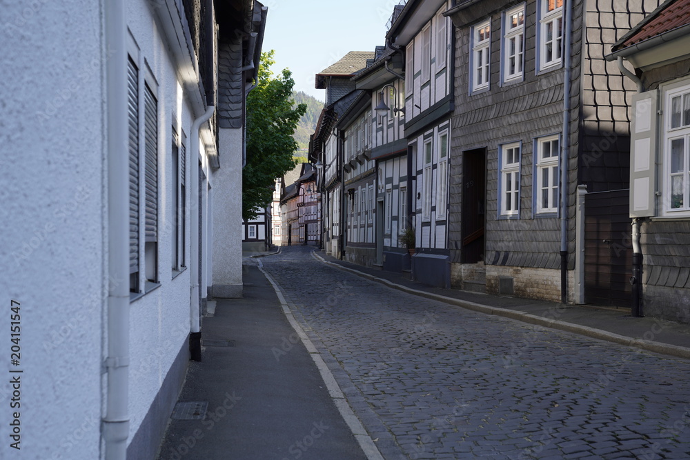 Tiny street with old nordic style houses in the town of Goslar, Germany in the Harz region.