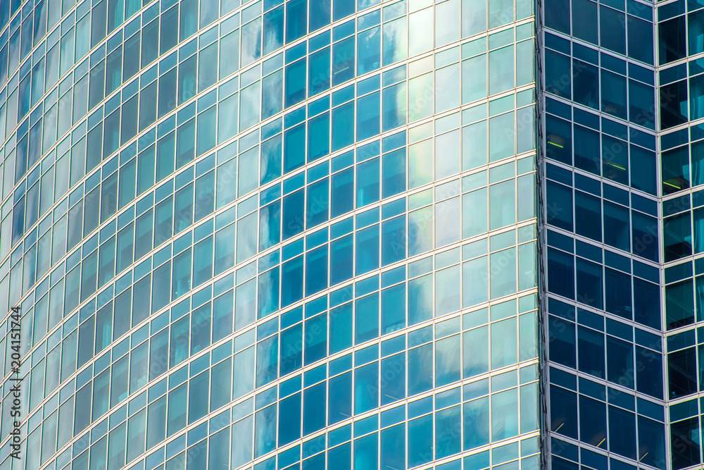 Reflection shiny green, emerald color glass, wave with bend facade windows of financial skyscrapers. Reflection shiny green, emerald color glass, wave with bend facade windows of financial skyscrapers.