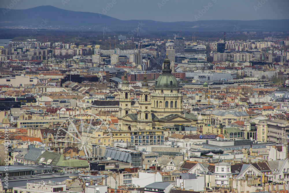 View on the basilica of Saint Istvan in Budapest, Hungary, panoramic view and blooming trees from viewpoint on Gellert hill on sunny spring day