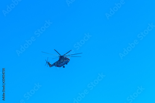 Fototapeta Naklejka Na Ścianę i Meble -  helicopters in the blue sky flying parade