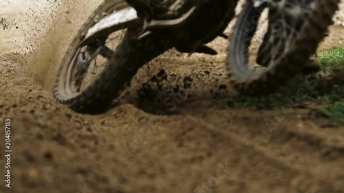 Shot of the Professional Motocross Driver Riding on His FMX Motorcycle on the Extreme Off-Road Track 4k
