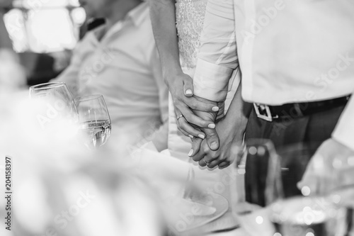 hands loving couple together table glasses