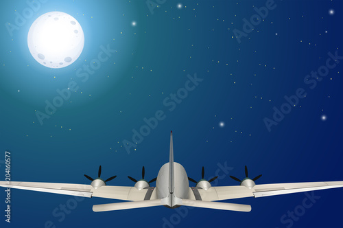 An Airplane Flying at Night