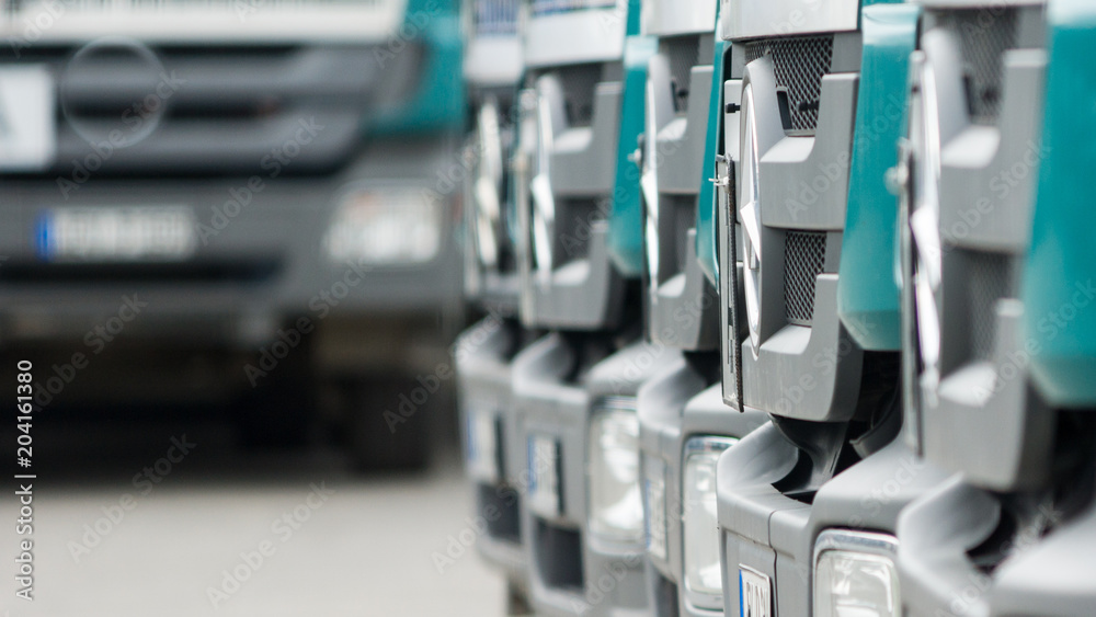 Same trucks parked in row Same trucks parked in row