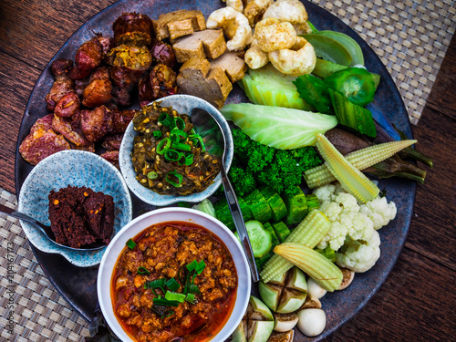 Thai food - Northern style dips with northern thai spicy sausage (sai oua), fried pork skin and Vetgetable Set photo