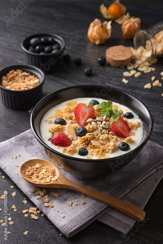 Concept of healthy food and lifestyle  Breakfast meal  Natural yogurt with fresh berries and cereal.