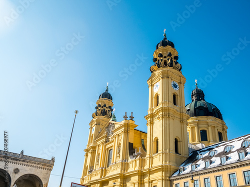 feldherrnhalle and tower of theatinerkirche theatinerchurch at odeon square odeonplatz in munich city bavaria germany tower clock time detail landscape orientation.Winter season Germany. photo