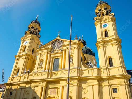 feldherrnhalle and tower of theatinerkirche theatinerchurch at odeon square odeonplatz in munich city bavaria germany tower clock time detail landscape orientation.Winter season Germany. photo