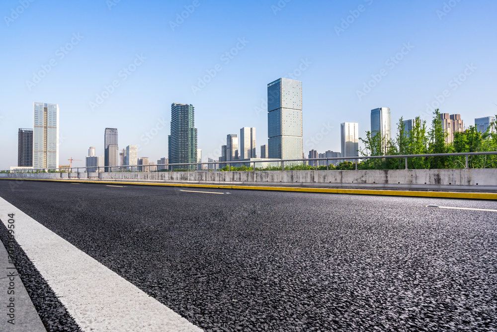 empty aspahalt road with modern building empty aspahalt road with modern building
