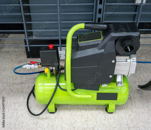 Bright green portable air compressor and accessories