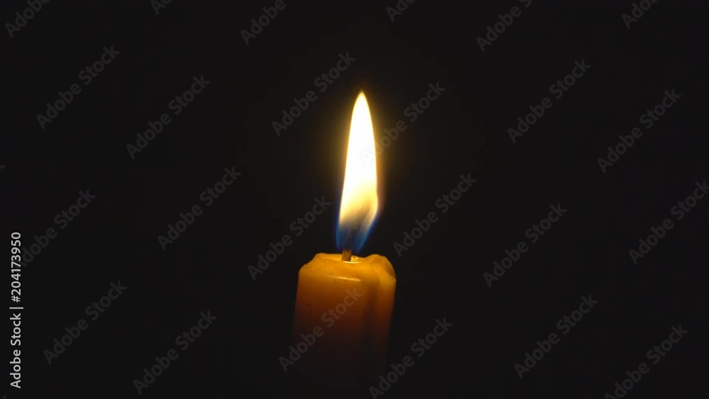 Fire of candle on black background center of frame. Low light and dramatic scene. 4k 3840x2160 hi resolution. Fire of candle on black background center of frame. Low light and dramatic scene. 4k 3840x2160 hi resolution.