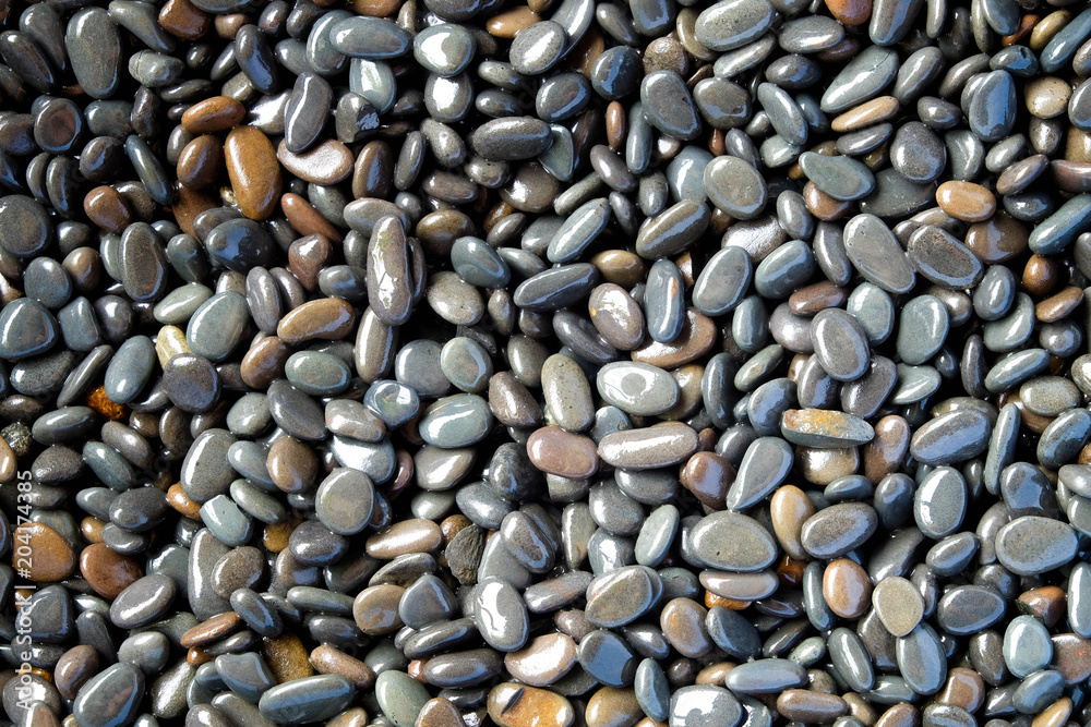 Abstract background texture, Colorful sea stones in water, top view Abstract background texture, Colorful sea stones in water, top view