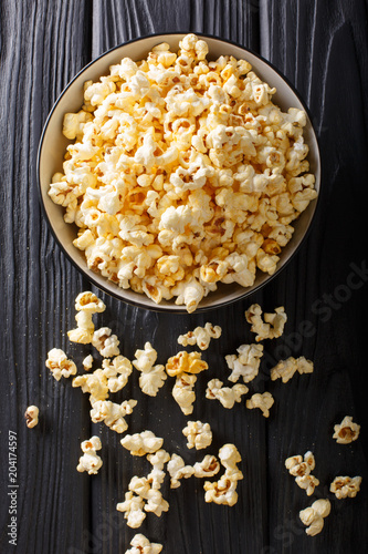 popcorn cheese in a bowl closeup. Vertical top view