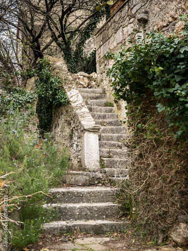 Stairs leading to he entrance of an old stone house
