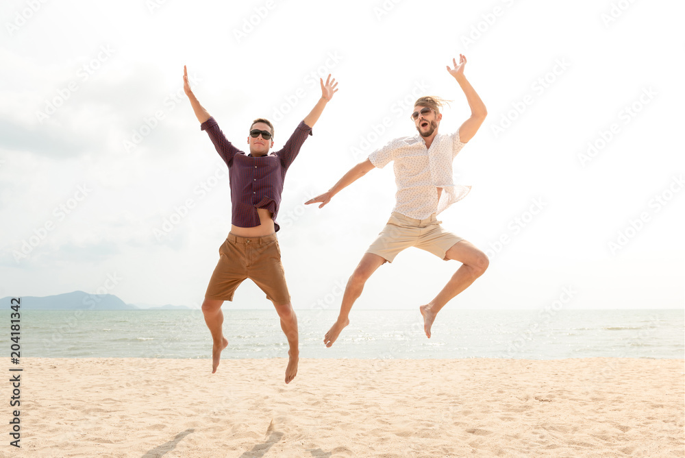 Young energetic happy tourist men jumping at the beach Young energetic happy tourist men jumping at the beach