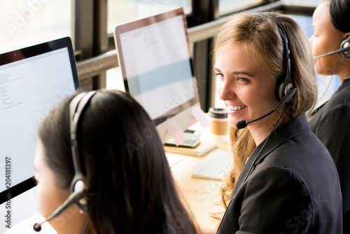 Woman customer service agent working in call center