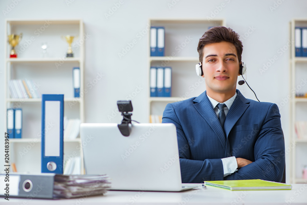 Young help desk operator working in office