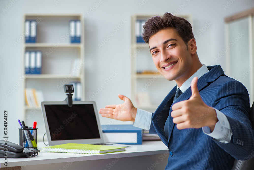 Young help desk operator working in office Young help desk operator working in office