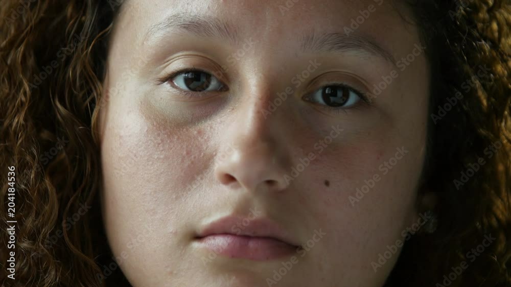 Face of a young woman, blank stare Face of a young woman, blank stare