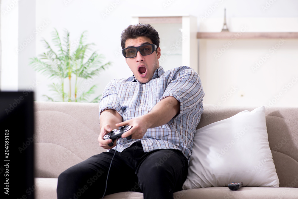 Man playing 3d games at home Man playing 3d games at home