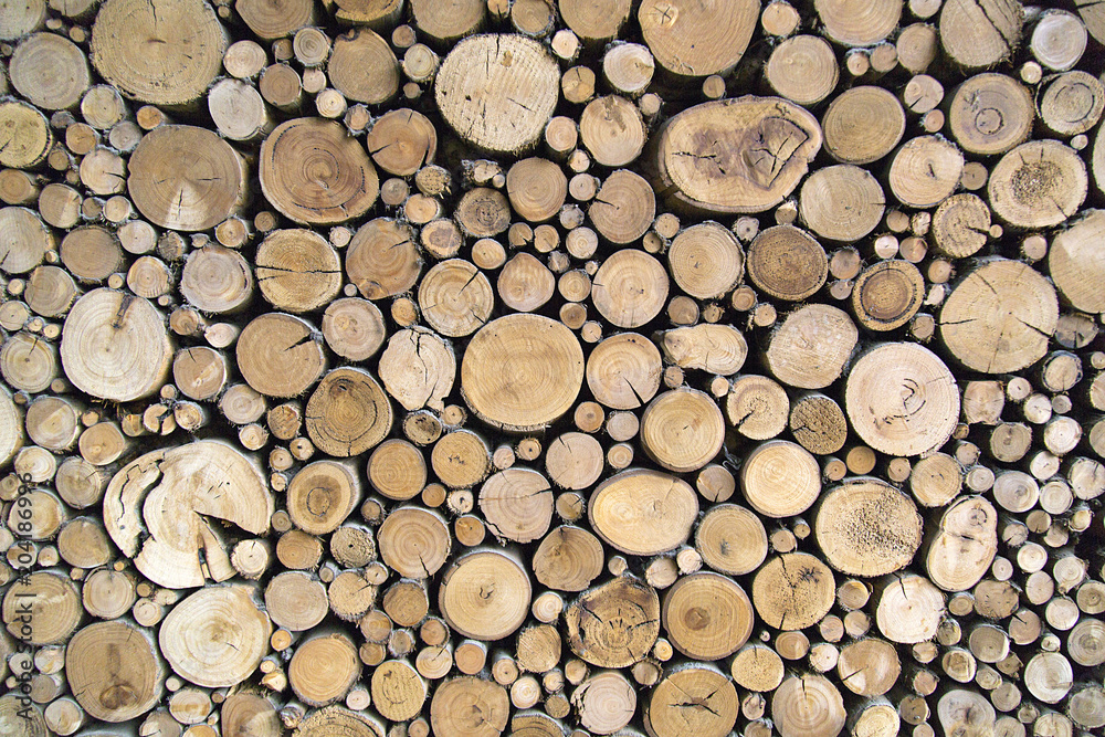 Sawn timber logs stacked for a wood burning stove. Close up in full frame and a horizontal format Sawn timber logs stacked for a wood burning stove. Close up in full frame and a horizontal format