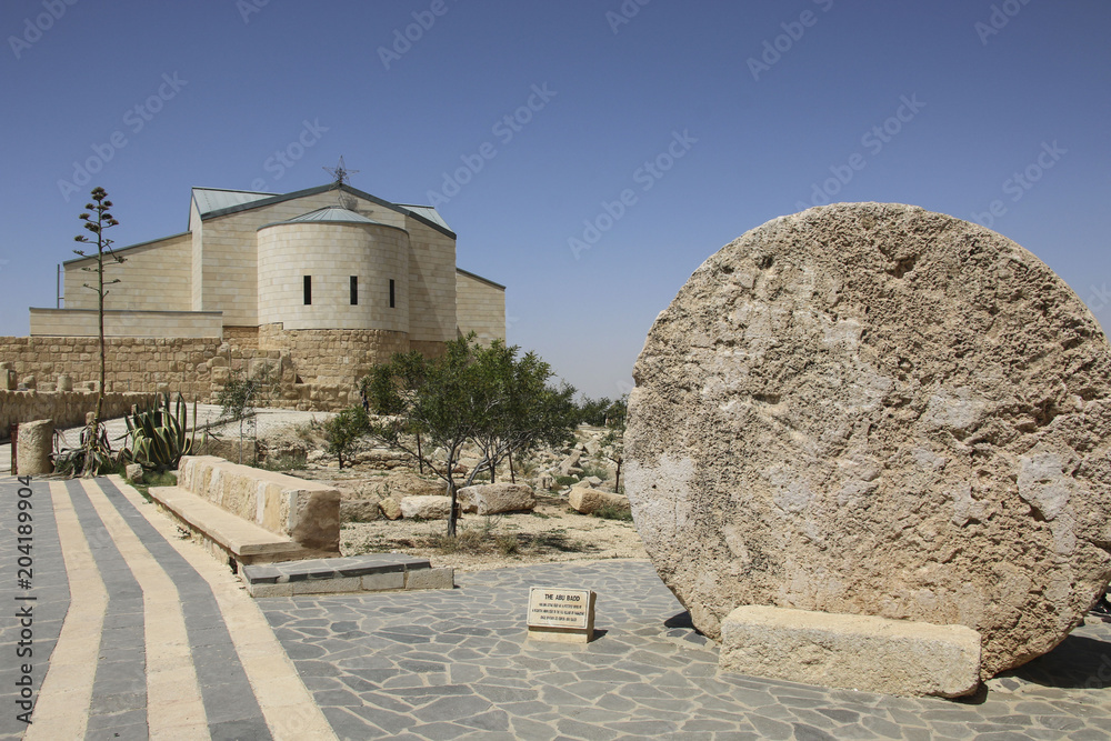 The Memorial church of Moses and Abu badd - rolling stone used as door of Byzantine Monastery on Mount Nebo, Jordan The Memorial church of Moses and Abu badd - rolling stone used as door of Byzantine Monastery on Mount Nebo, Jordan