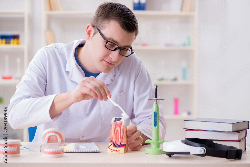 Dentist working teeth implant in medical lab Dentist working teeth implant in medical lab