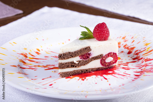 Вкусный и красивый десерт с ягодой малиной. Tasty and beautiful dessert with berry raspberry
