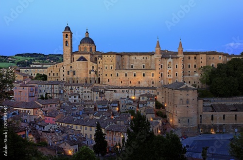 The Palazzo Ducale with houses of the historic city Urbino in the dusk, Marche region, Italy, Europe