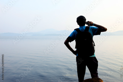 Photography A young man phone near the pond in india