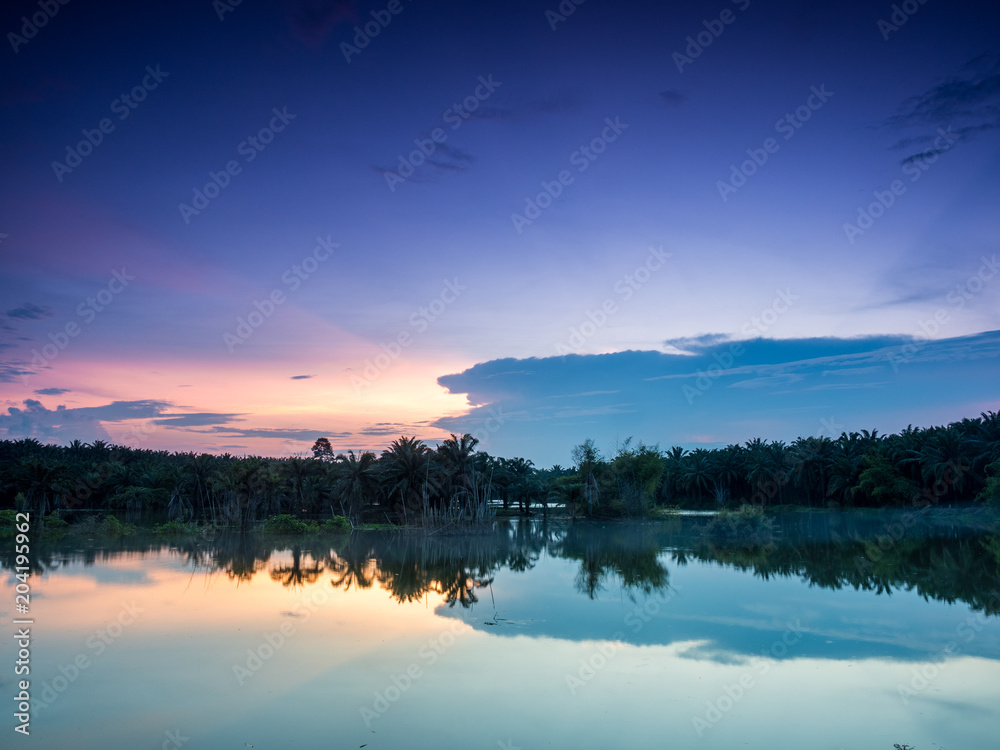 Fototapeta premium twilight at the lake with two tone sky
