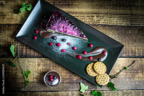 Homemade cheesecake with fresh berries and chocolate