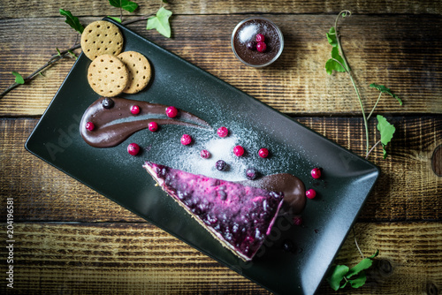 Homemade cheesecake with fresh berries and chocolate