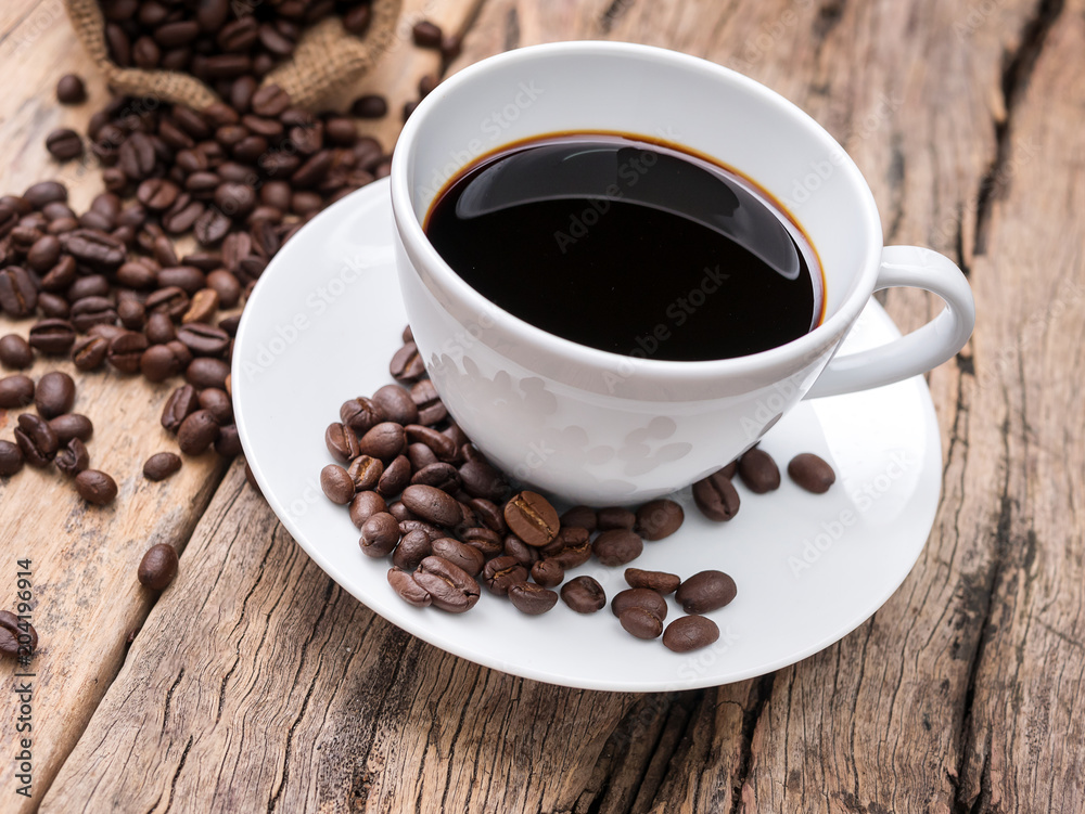 fresh espresso coffee cup with coffee bean on wooden table. coffee background for cafe or coffee shop fresh espresso coffee cup with coffee bean on wooden table. coffee background for cafe or coffee shop