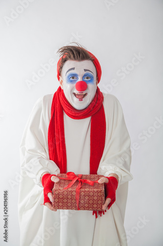 emotional guy holding a gift. Human emotions: greed and joy