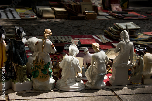 ceramic girl firgues on a street market